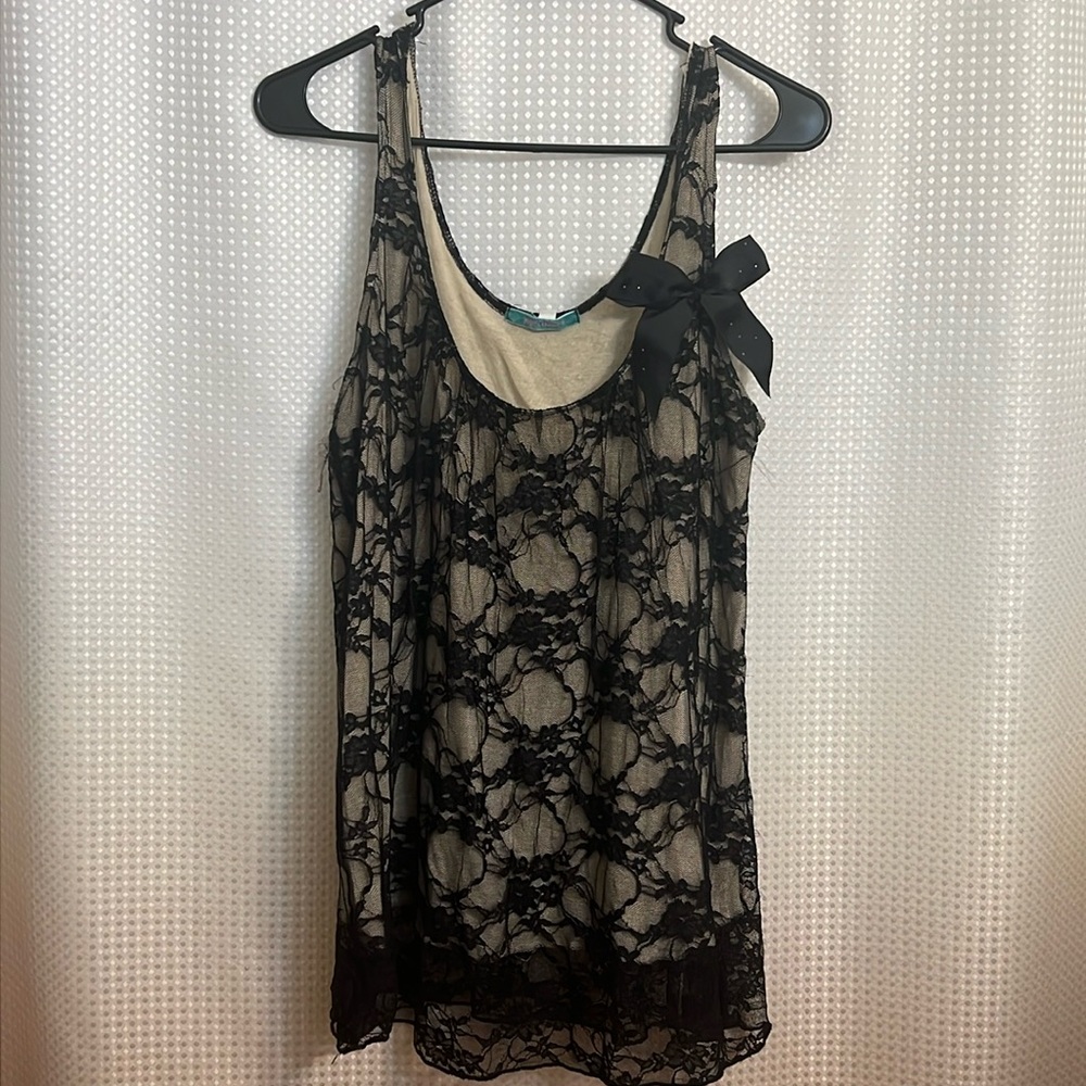 Tan and black lace tank with a black bow